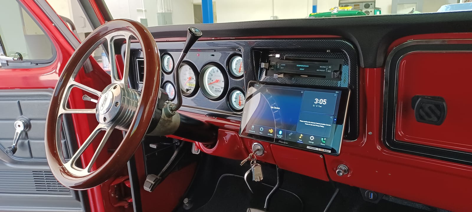 Aftermarket Pioneer touchscreen radio installed in a classic truck dash at DV Audio and Customs in Escondido