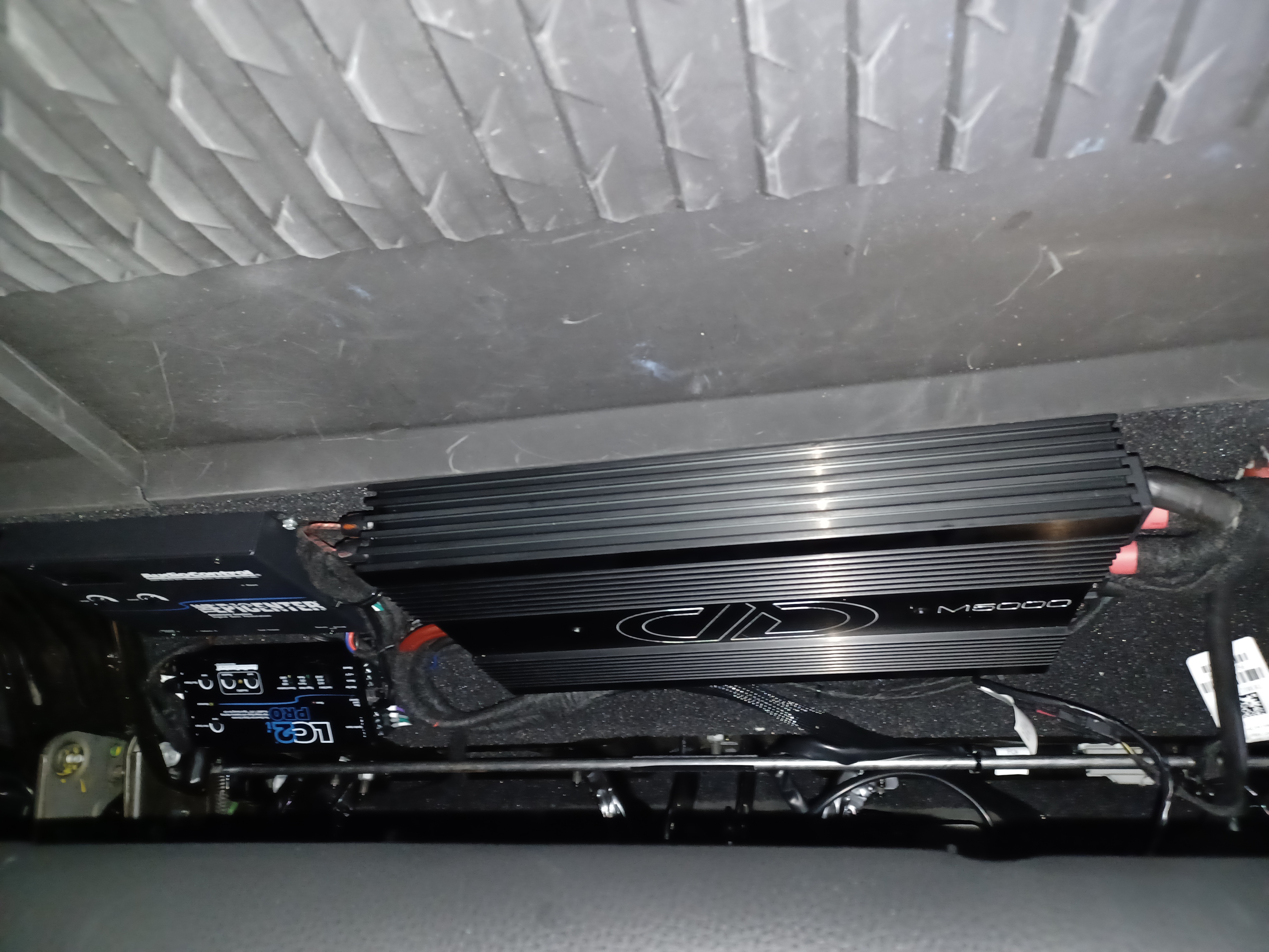 Amplifier and processor install mounted under the seat for a custom car audio system, Escondido