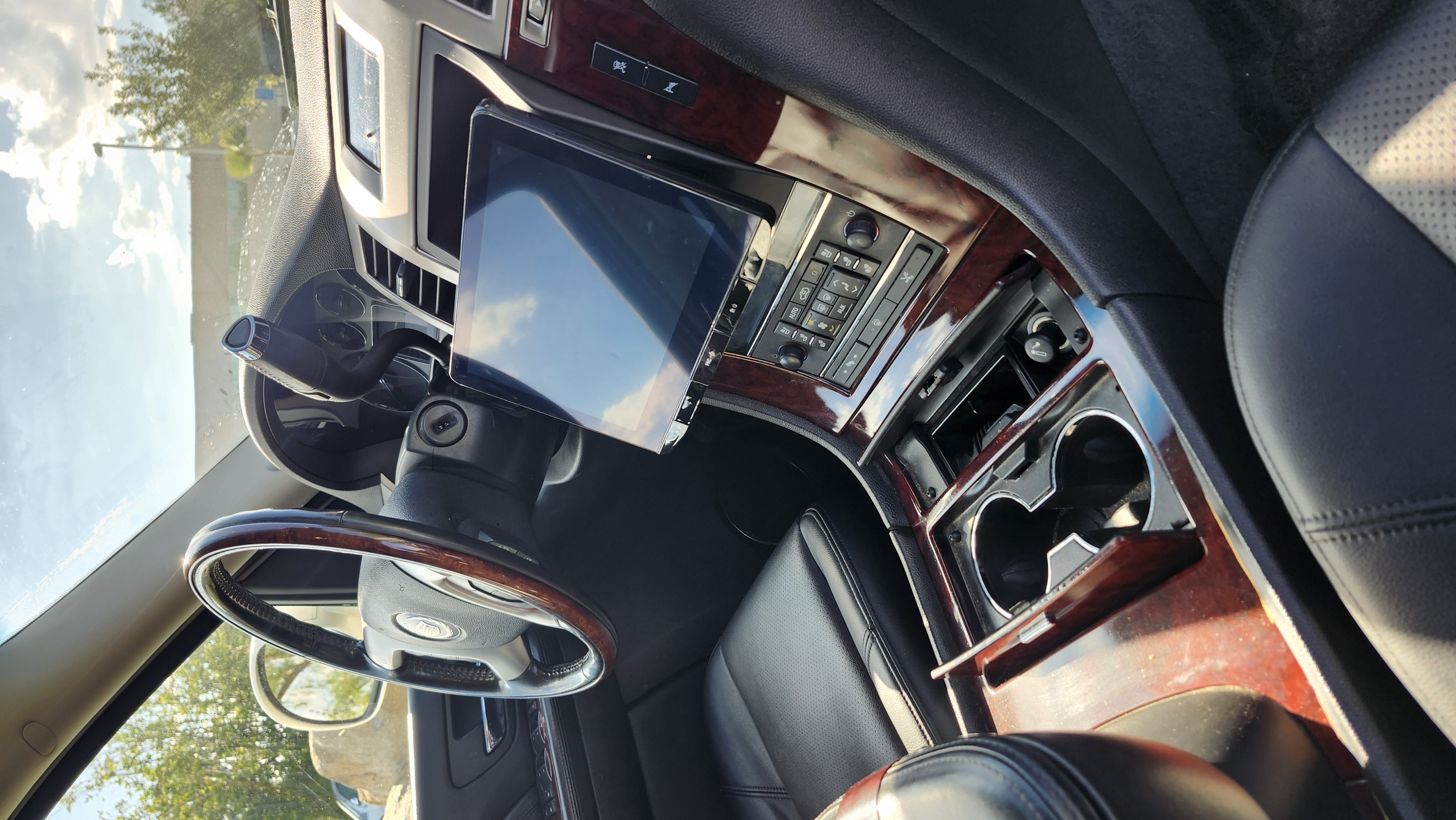 Apple CarPlay tablet integration in a classic car with wood trim, Escondido car audio